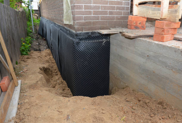SJ Waterproofing Pros technician performing targeted Sump Pump Installation assessment in Montrose, MN